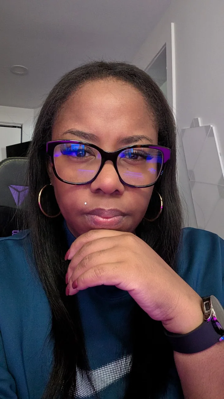 MissKalunji wearing her signature glasses